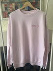 Crewneck sweatshirt featuring an all-over patchwork heart front design.
