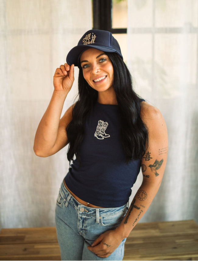 Woman wearing a navy embroidered 