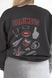 Close-up of the back of a person wearing a charcoal gray crewneck sweatshirt featuring large 