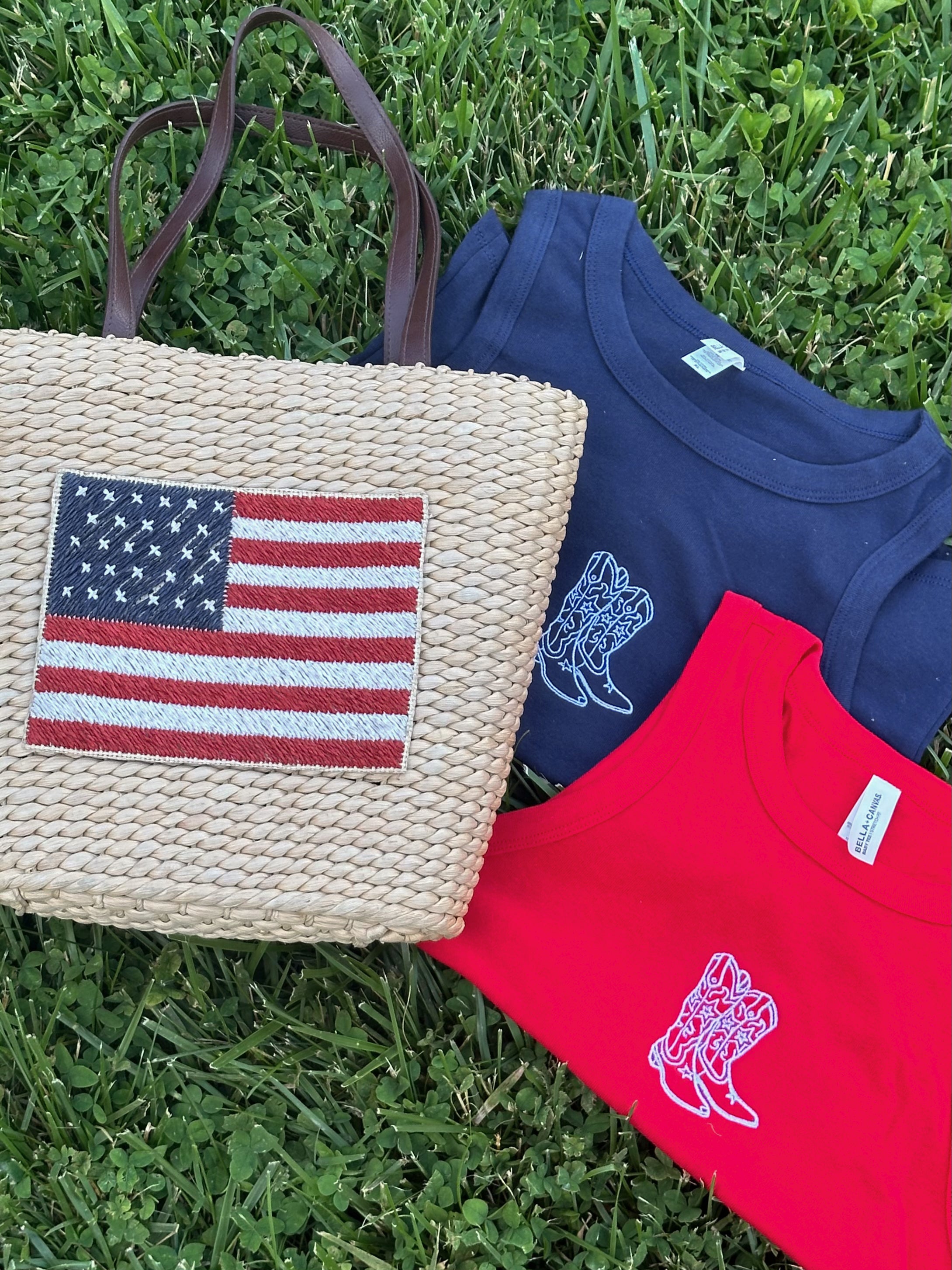 Close-up of a navy and red embroidered cowgirl boots tank featuring a western-inspired boot design.
