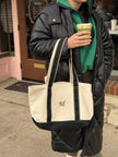 Personalized canvas tote embroidered with a custom initial.