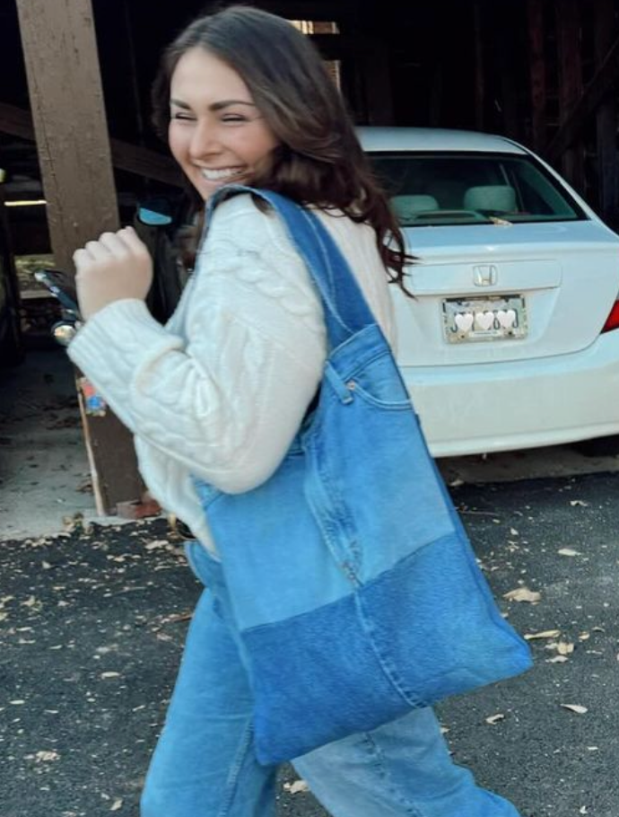 Model carrying the handcrafted upcycled denim tote bag.