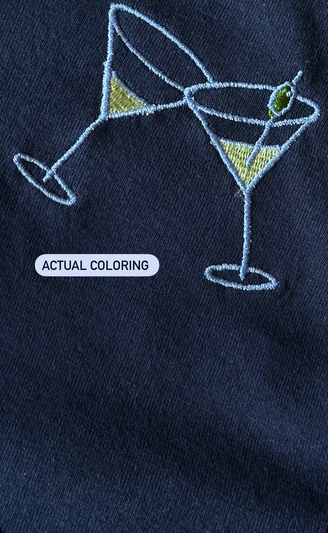 Close-up of the embroidered martini glass design on the navy Tini Tank.