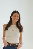 Model wearing a white custom future last name tank featuring personalized navy embroidery for brides-to-be.