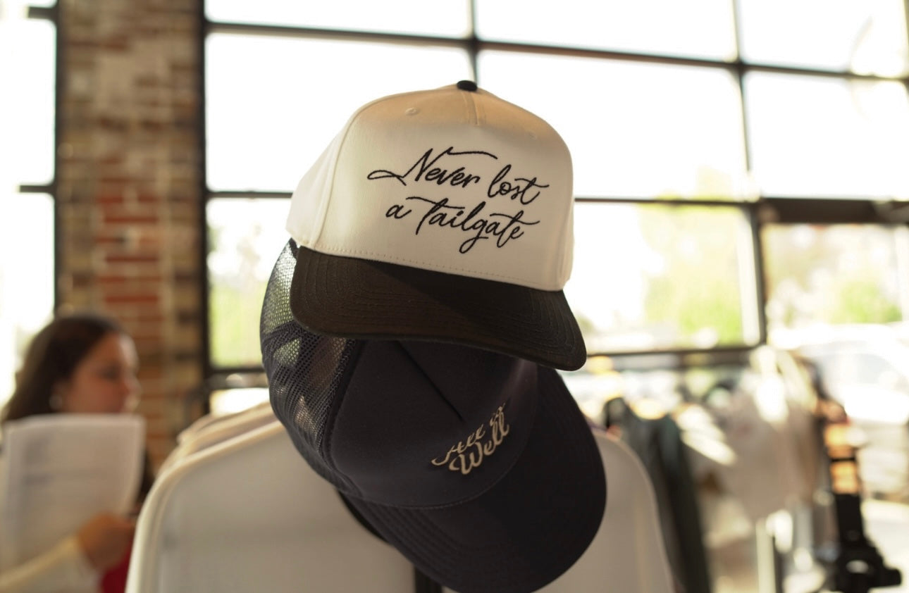 Ivory and Black mesh trucker hat featuring 