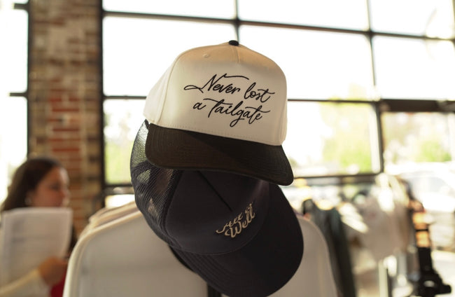 Ivory and Black mesh trucker hat featuring 