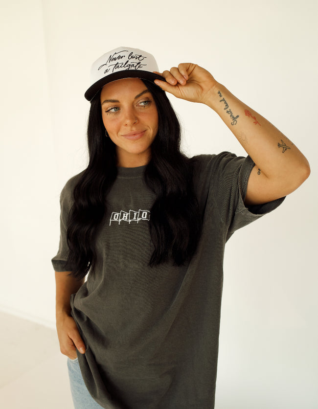 Woman wearing a slate gray Ohio Flags Comfort Colors embroidered T-shirt with a casual everyday outfit.