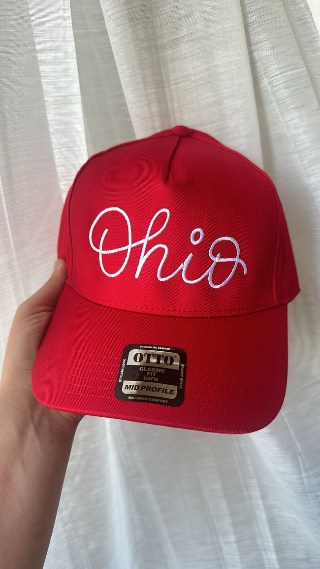 Close-up of the red embroidered Ohio design on a structured trucker-style hat.