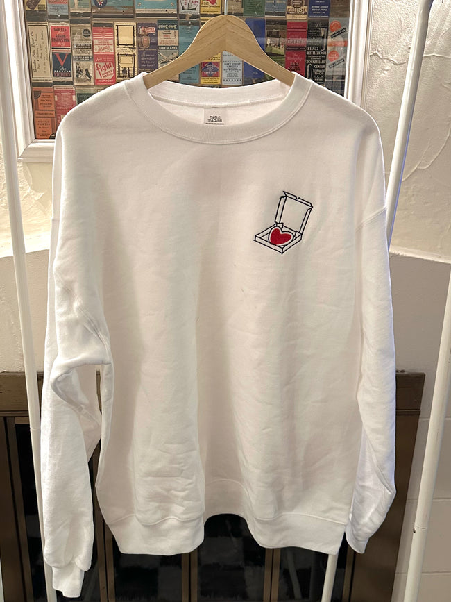 White crewneck sweatshirt embroidered with the Pizza Lover design on the chest.