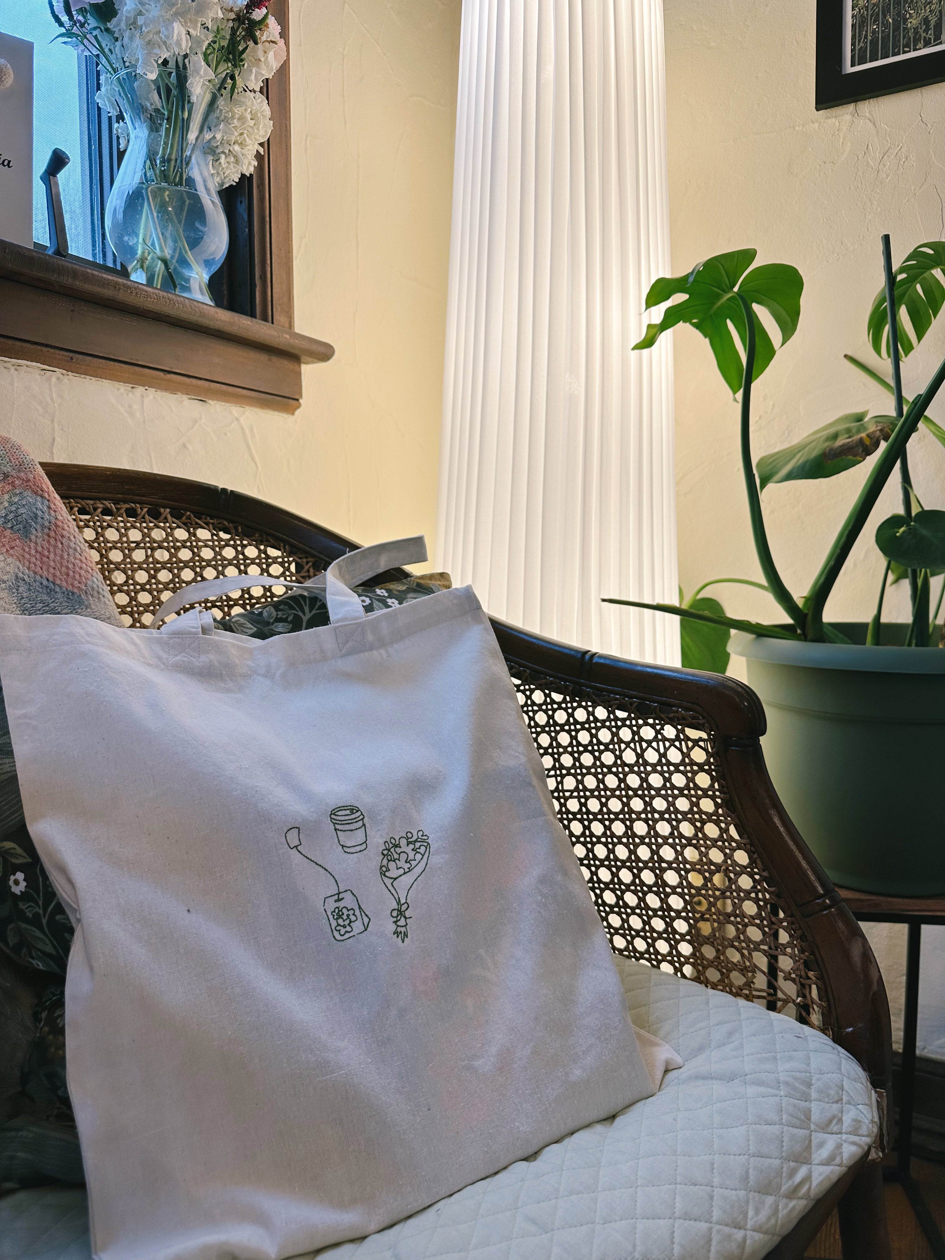 Natural canvas tote bag with the Simple Saturday graphic design.