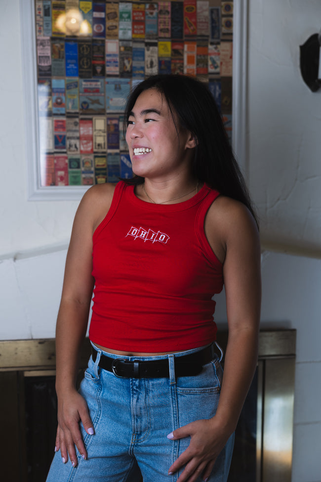 Model wearing a red Ohio embroidered tank top featuring a vintage-inspired white 