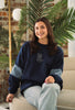 Model wearing the Western Denim Crew sweatshirt styled with casual denim.